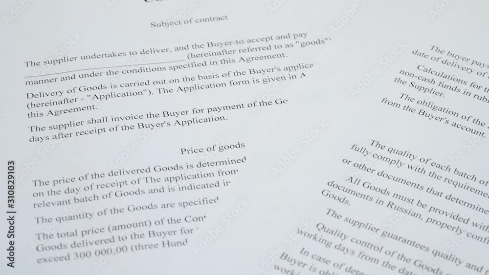 Abstract the text of the contract on paper closeup. The pen is on the paper with the contract. Business, responsibilities, partnership. Abstract the text of the contract on paper closeup. The pen is on the paper with the contract. Business, responsibilities, partnership.