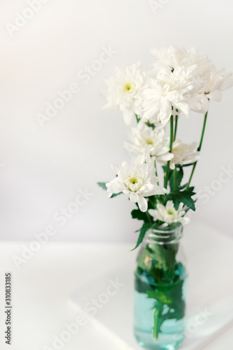 white flower on white table