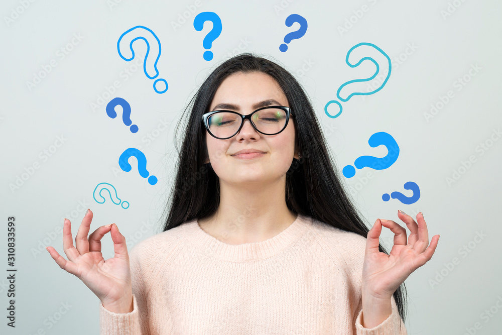 Image of excited young lady with glasses. Looking camera have an idea. Stands on a white background. Image of excited young lady with glasses. Looking camera have an idea. Stands on a white background.