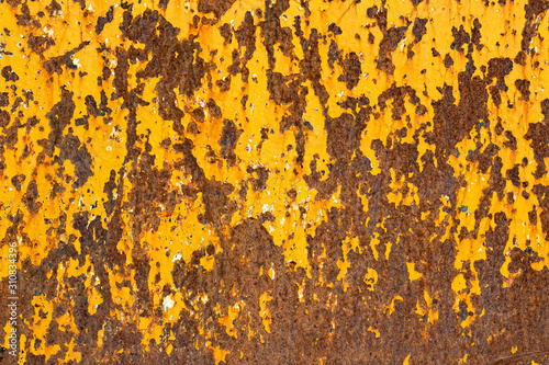 Rusty metal surface with traces of orange paint, texture, background.