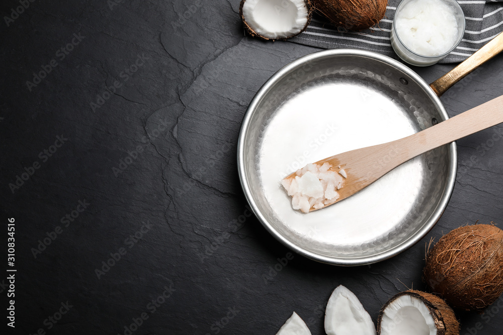 Flat lay composition with coconut oil and frying pan on black table, space for text. Healthy cooking Flat lay composition with coconut oil and frying pan on black table, space for text. Healthy cooking