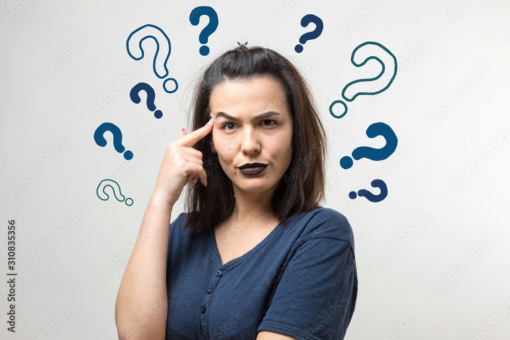 Image of excited young lady with glasses. Looking camera have an idea. Stands on a white background. Image of excited young lady with glasses. Looking camera have an idea. Stands on a white background.