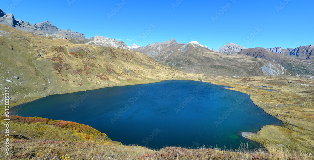 beautiful blue lake in alpine european mountain in autumn