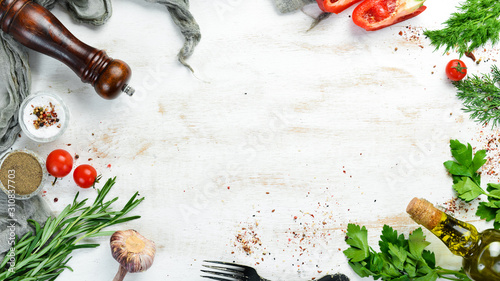 White wooden background of cooking. Vegetables and Ingredients. Top view. Free space for your text.