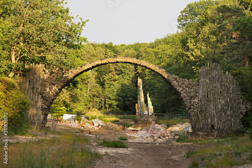 Rebuilding of Bridge of Devil (Rakotzbrucke) over Rakotzsee lake at Park Kromlau near Gablenz. Germany