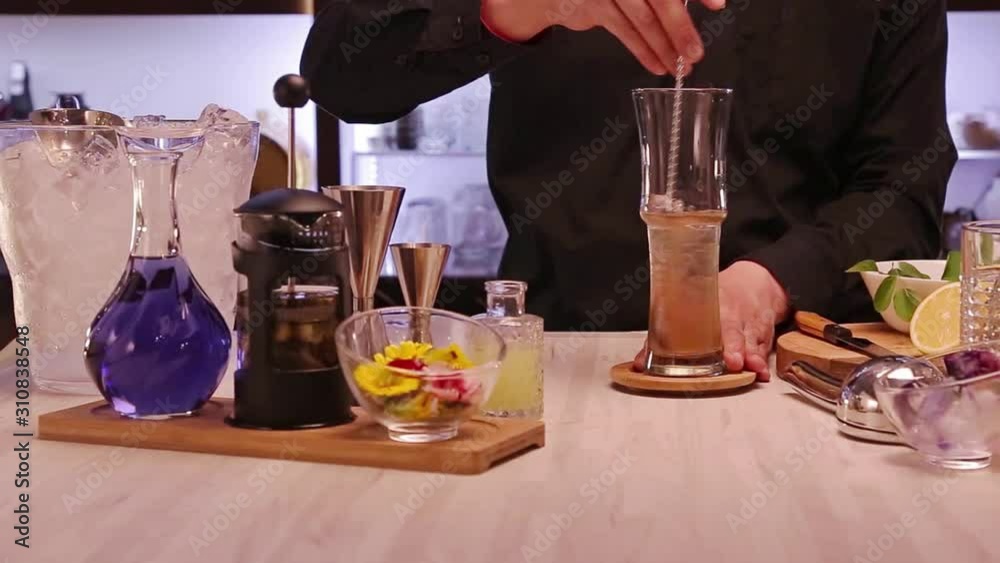 Stirring the Water Mix with a Iron Spoon - Pan Left To Right Stirring the Water Mix with a Iron Spoon - Pan Left To Right