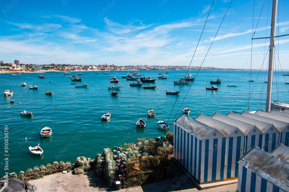View of fishing boats in Cascais bay. Portugal in autumn