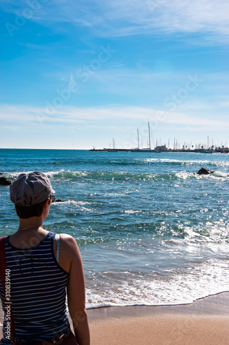 View of Atlantic ocean with a tourist. Cascais-Estoril, Portugal
