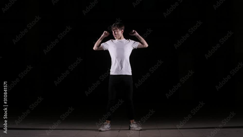 young dancer dancing break dance, hip hop, street dance in the studio on a black background, isolated young dancer dancing break dance, hip hop, street dance in the studio on a black background, isolated