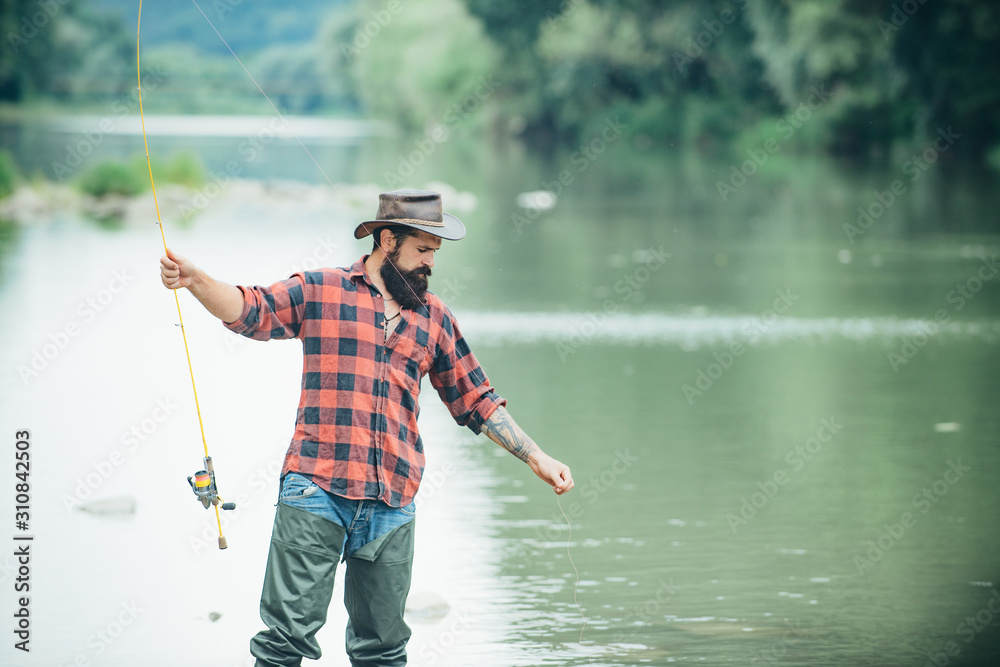 Obraz premium Male hobby and recreation. Fishing freshwater lake pond river. Difference between fly fishing and regular fishing. Catch me if you can. Hunting. It is not sport it is obsession.