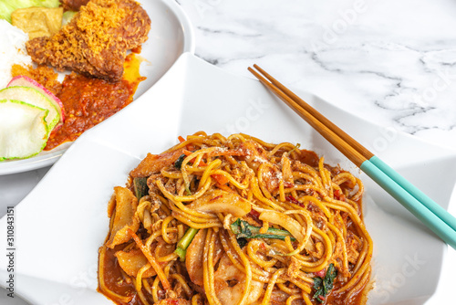 Mee goreng, is an Asian Malay spicy fried noodle dish, originating from Indonesia, common in Malaysia, Brunei, Singapore.