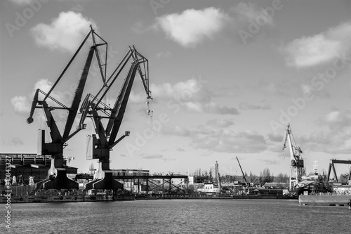 Big cranes and dock at the shipyard. Gdansk, Poland