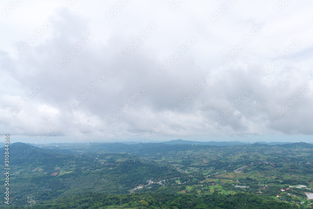 Obraz premium beautiful blue sky high peak mountains mist fog wildlife green forest at Khao Koh, Phu Tub Berk, Phetchabun, Thailand guiding idea long weekend for backpacker camping campfire relaxing hiking