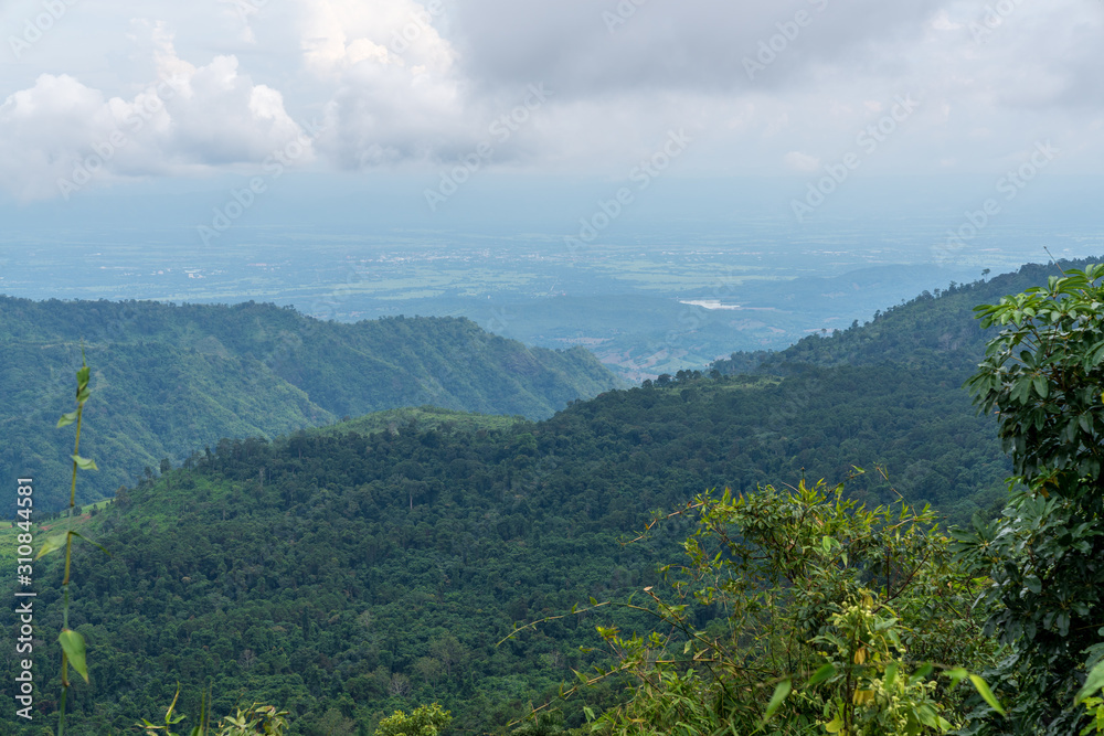 Naklejka premium beautiful blue sky high peak mountains mist fog wildlife green forest at Khao Koh, Phu Tub Berk, Phetchabun, Thailand guiding idea long weekend for backpacker camping campfire relaxing hiking