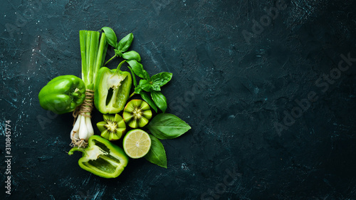 Fototapeta Naklejka Na Ścianę i Meble -  Fresh Green Fruits and Vegetables. Organic food. Rustic style. Top view. Free space for text.