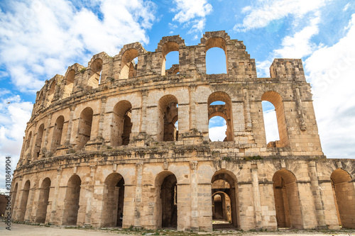  Exterior of Old antique amazing well conserved huge Amphitheatre of El Jem in Tunisia. Horizontal color photography.