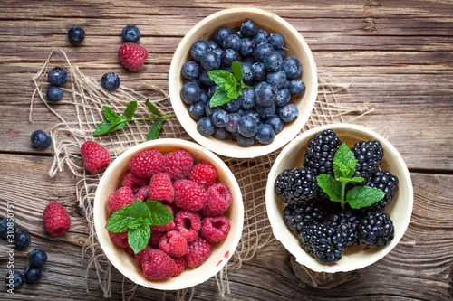 Blackberries, raspberries and blueberries in a waffle bowls.