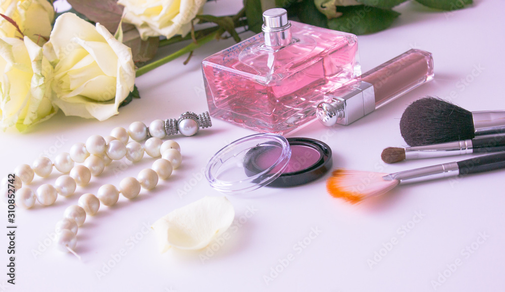 Makeup cosmetics tools background and beauty cosmetics, products and facial cosmetics package lipstick, eyeshadow on the white background, top view and copy space. Lifestyle Beauty Concept
