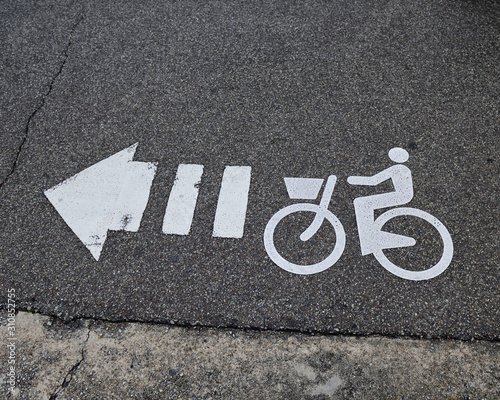 Sign bicycle lane paint on asphalt road in Japan