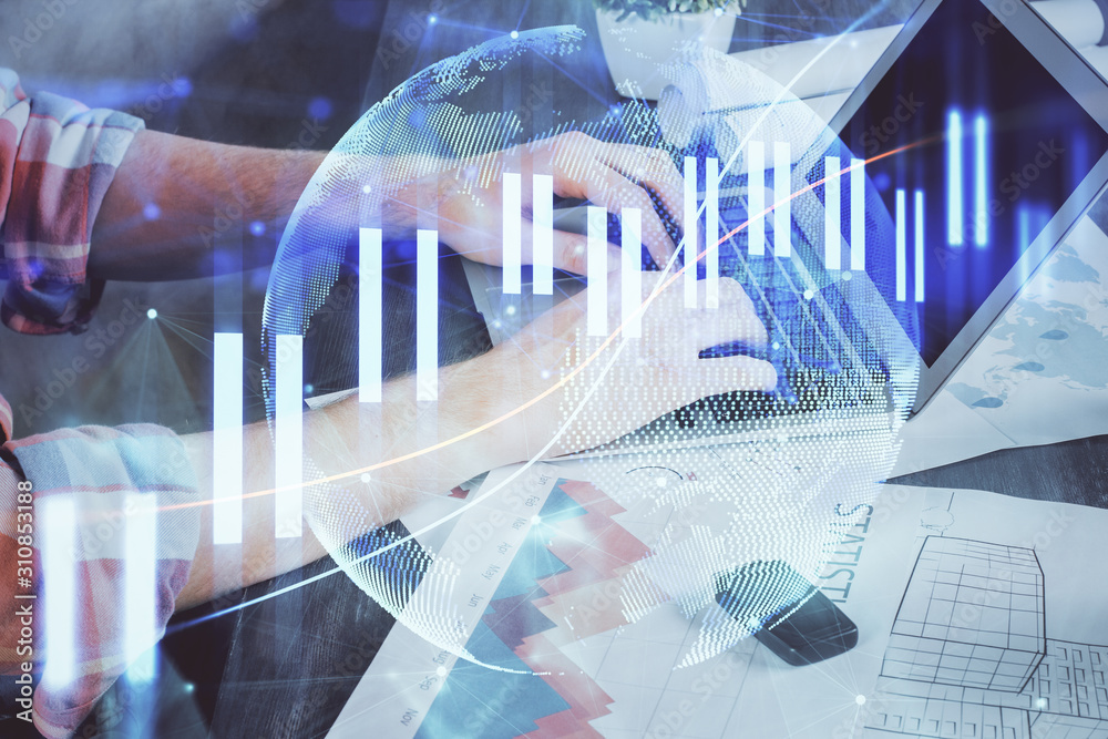 Double exposure of stock graph with businessman typing on computer in office on background. Concept of hard work. Double exposure of stock graph with businessman typing on computer in office on background. Concept of hard work.