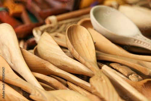 Wooden spoons on the counter in the market