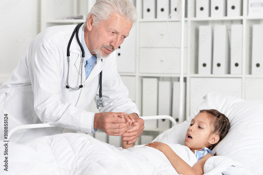 Obraz premium Portrait of man doctor and girl in hospital