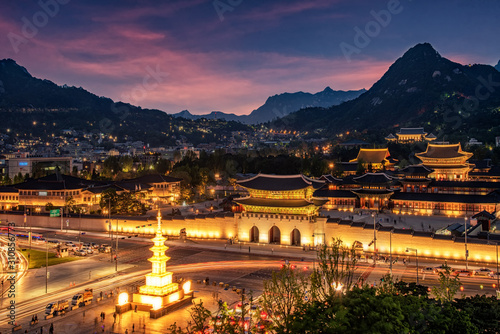Gyeongbokgung Palace At Night In South Korea, with the name of the palace 'Gyeongbokgung' on a sign.