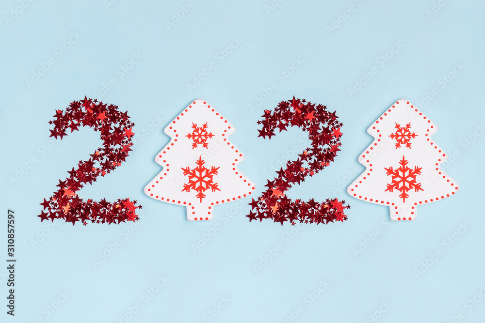 New Year and Christmas composition. 2020 year date on pastel blue paper background. Top view, flat lay New Year and Christmas composition. 2020 year date on pastel blue paper background. Top view, flat lay