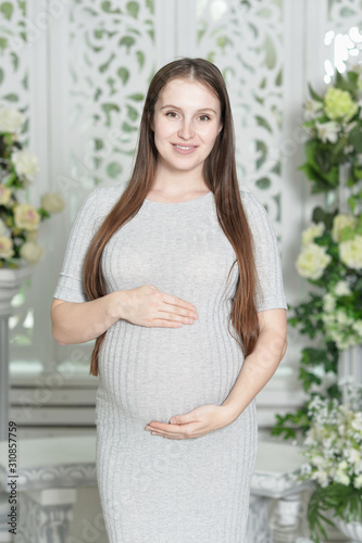 Portrait of a beautiful pregnant woman posing
