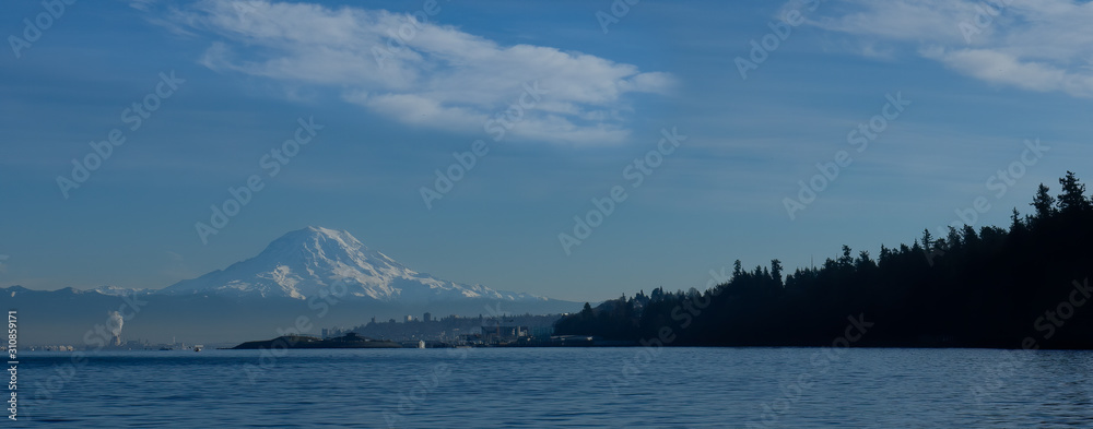 Panorama shot of Mt Rainier and Tacoma's Point Defiance Park as seen on a boat in the Narrows 