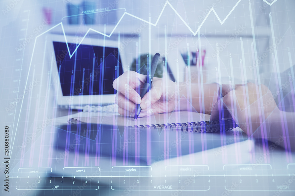Financial graph displayed on woman's hand taking notes background. Concept of research. Double exposure Financial graph displayed on woman's hand taking notes background. Concept of research. Double exposure