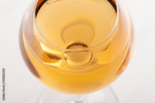 Glass of white wine with shadow. Top view. Abstract red wine bubbles. photo