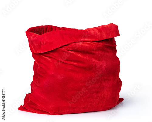 Santa Claus open red bag full, isolated on white background. File contains a path to isolation.