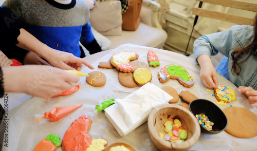Children's hands make gingerbread. children cutting cookies. Kids baking cookies. Concept. Master class for children on baking  gingerbread. photo