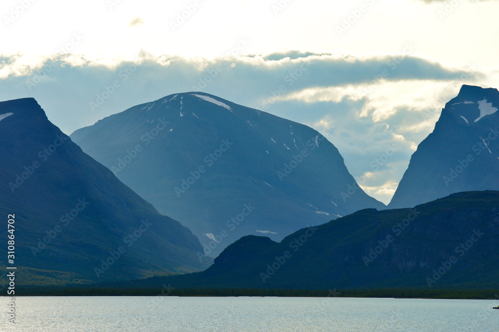 Big clouds over the biggest swedish mountains, kebnekaise valley in Sweden near Nikkaluokta