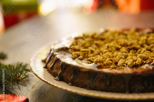 Christmas fruit cake on a gray background Gluten free christmas nut cake on a gray table with christmas decorations