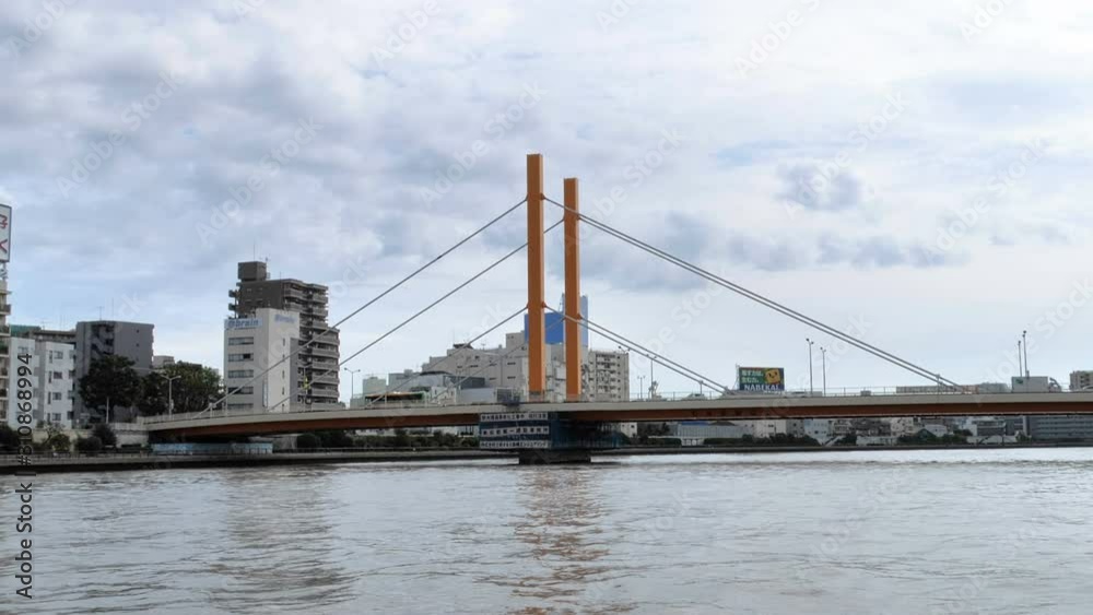 The big bridge with the cars passing through in Tokyo Japan The big bridge with the cars passing through in Tokyo Japan