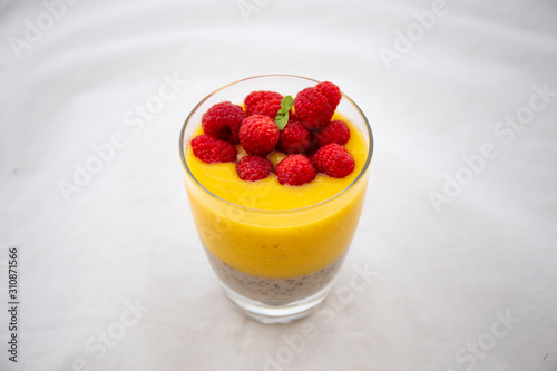 Chia pudding and Mango smoothie with raspberry topping