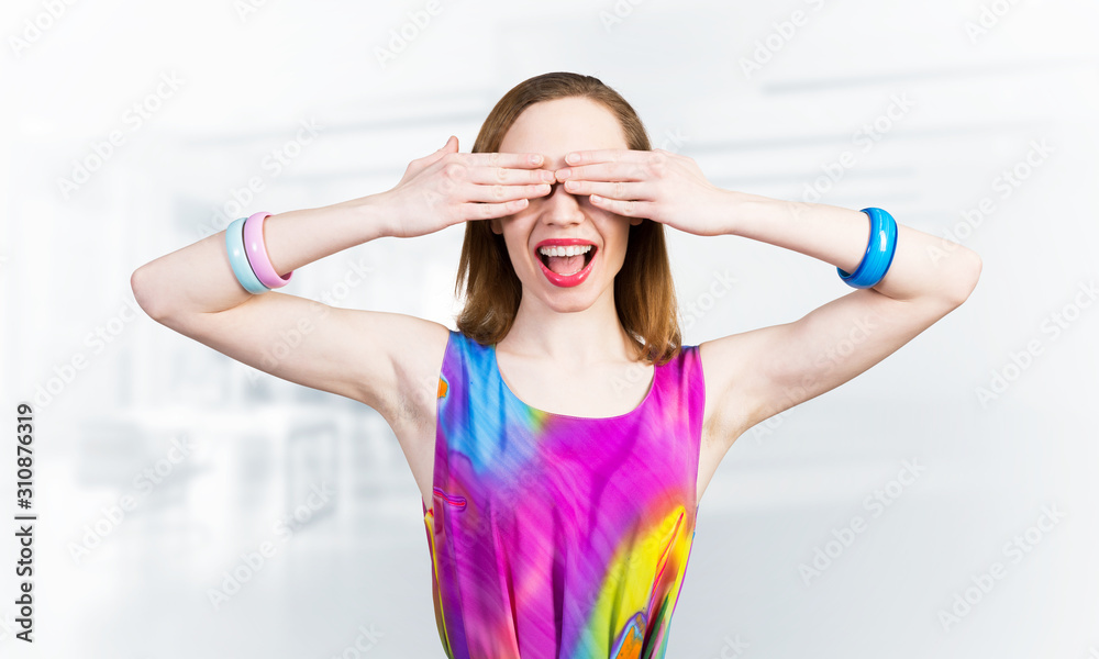 Redhead beautiful woman with hands covering eyes Redhead beautiful woman with hands covering eyes