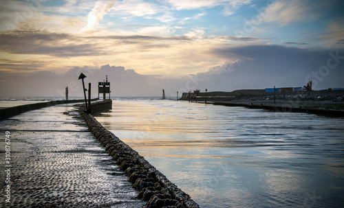 River Rother entering the sea at Rye Harbour, Sussex, England photo
