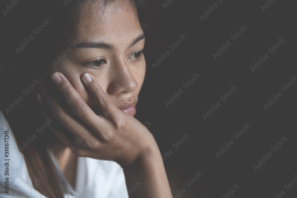 Young depressed woman, domestic and rape violence,beaten and raped sitting in the corner, Copy space. International Women's Day Young depressed woman, domestic and rape violence,beaten and raped sitting in the corner, Copy space. International Women's Day
