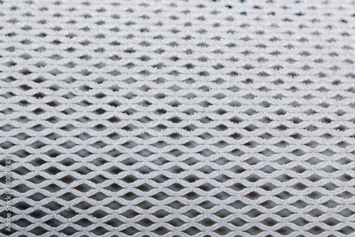Fine mesh covered with white hoarfrost, background, texture, selective focus