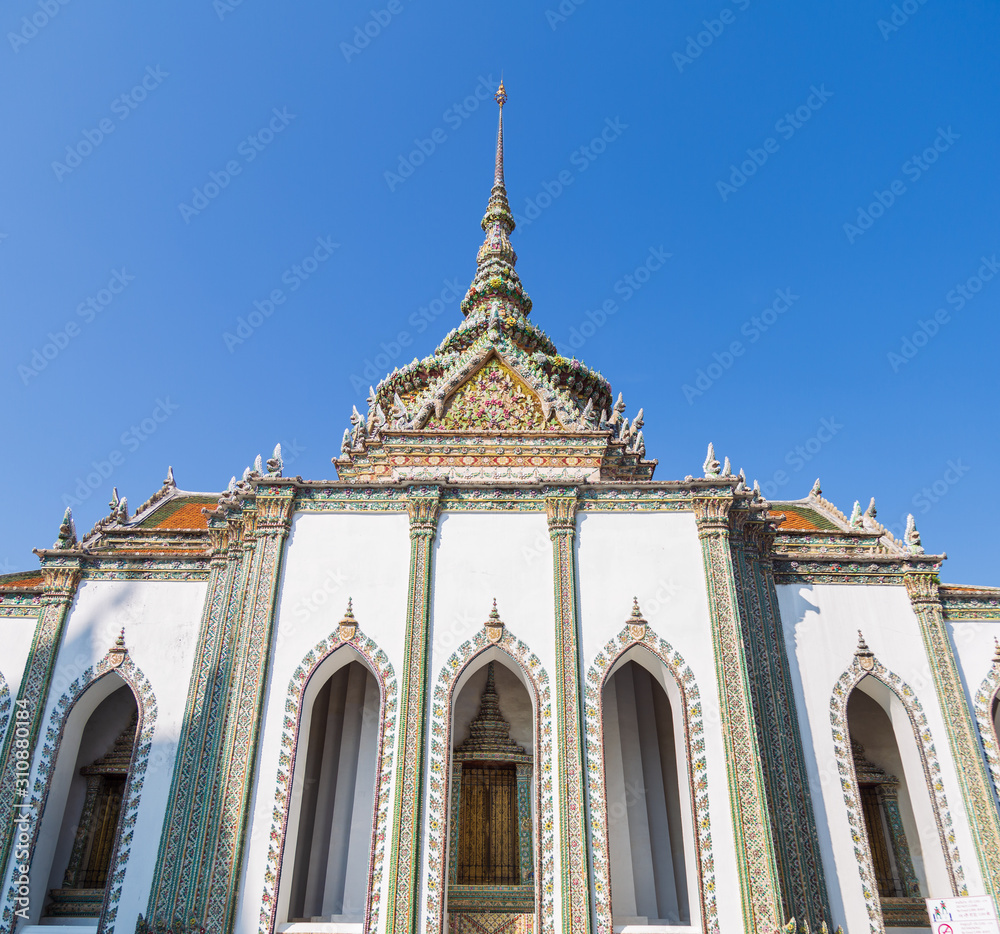 Front view of Phra Viharn Yord or The white sanctuary is one of the most sanctuary at Wat Phra Kaew, Temple of the Emerald Buddha is one of the most important Buddhist temples in Thailand, public area Front view of Phra Viharn Yord or The white sanctuary is one of the most sanctuary at Wat Phra Kaew, Temple of the Emerald Buddha is one of the most important Buddhist temples in Thailand, public area