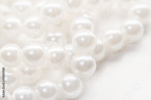 Bunch small pearl beads isolated white background