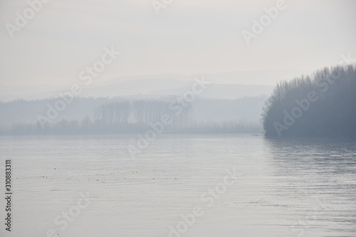 Foggy landscape of wide river  © Svetlana