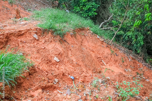 Drain damage. Soil erosion or landslide in the slope during the rainy season at Muadzam Shah, Malaysia.