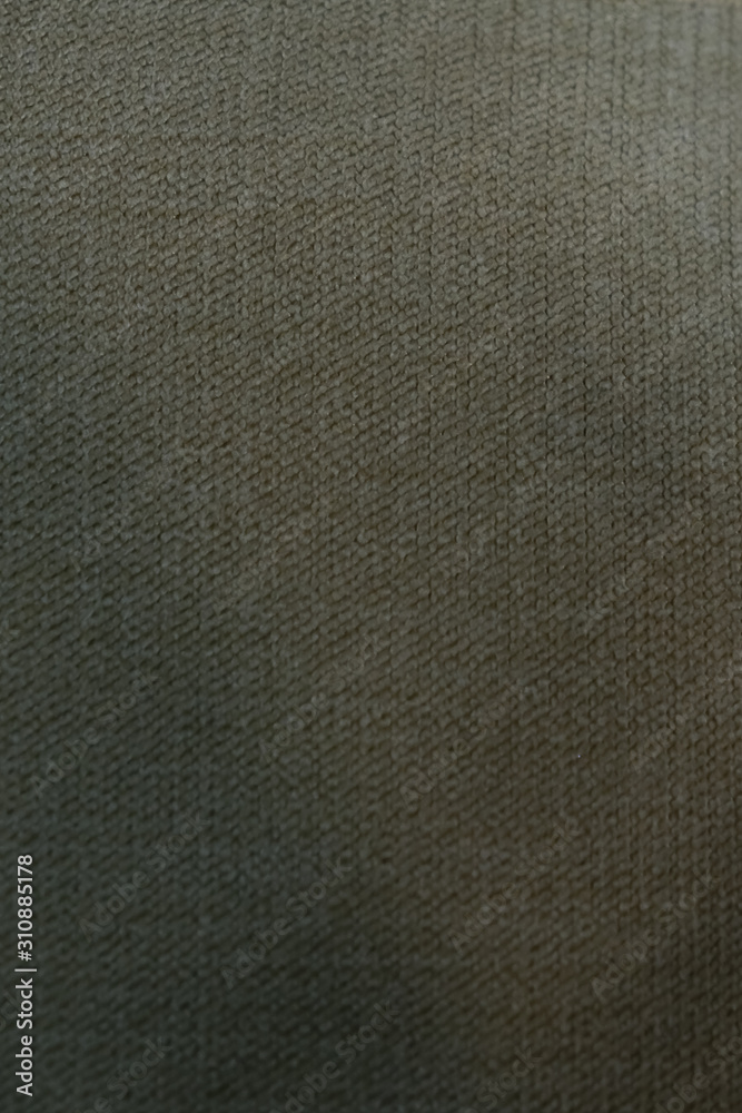 texture of dense fabric, green canvas closeup texture of dense fabric, green canvas closeup