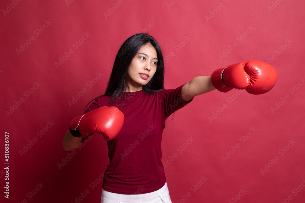 Young Asian woman with red boxing gloves. Young Asian woman with red boxing gloves.