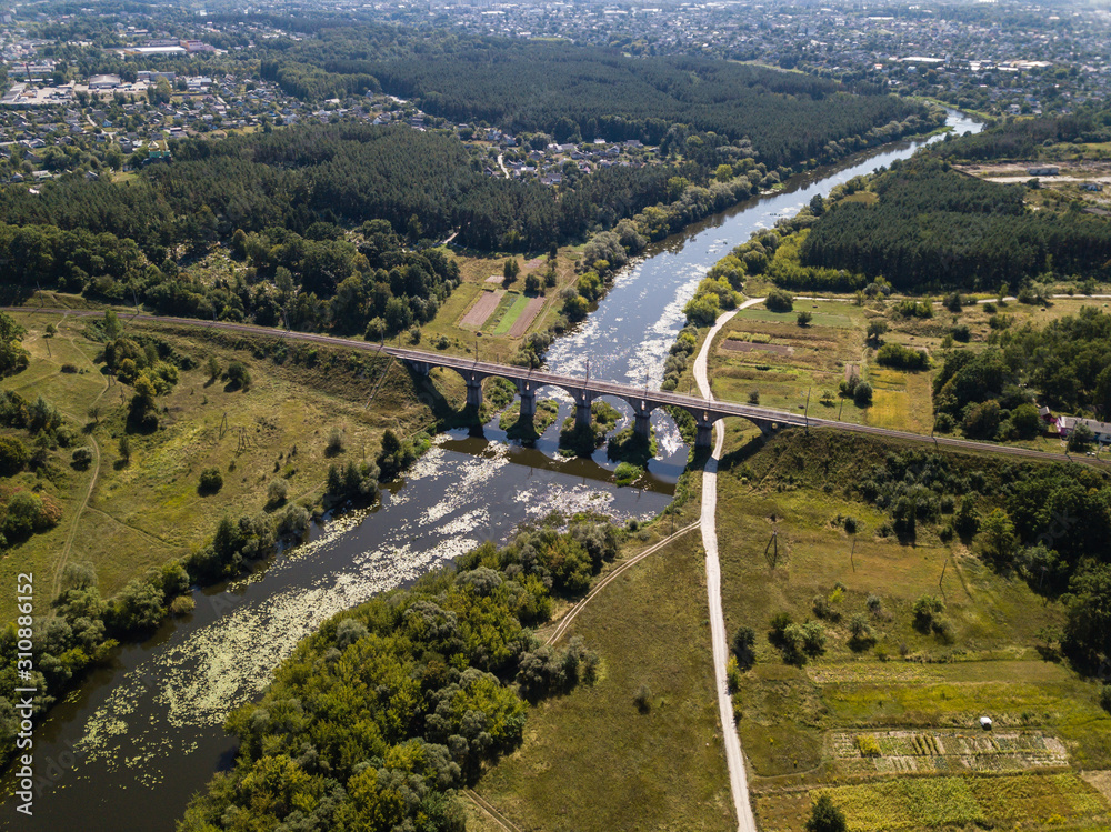 Beautiful railway bridge viaduct over river Sluch, Novograd Volynsky, Ukraine