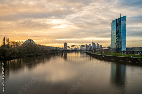 frankfurt skyline at sunset with colorful reflections in the main river, frankfurt am main, germany
